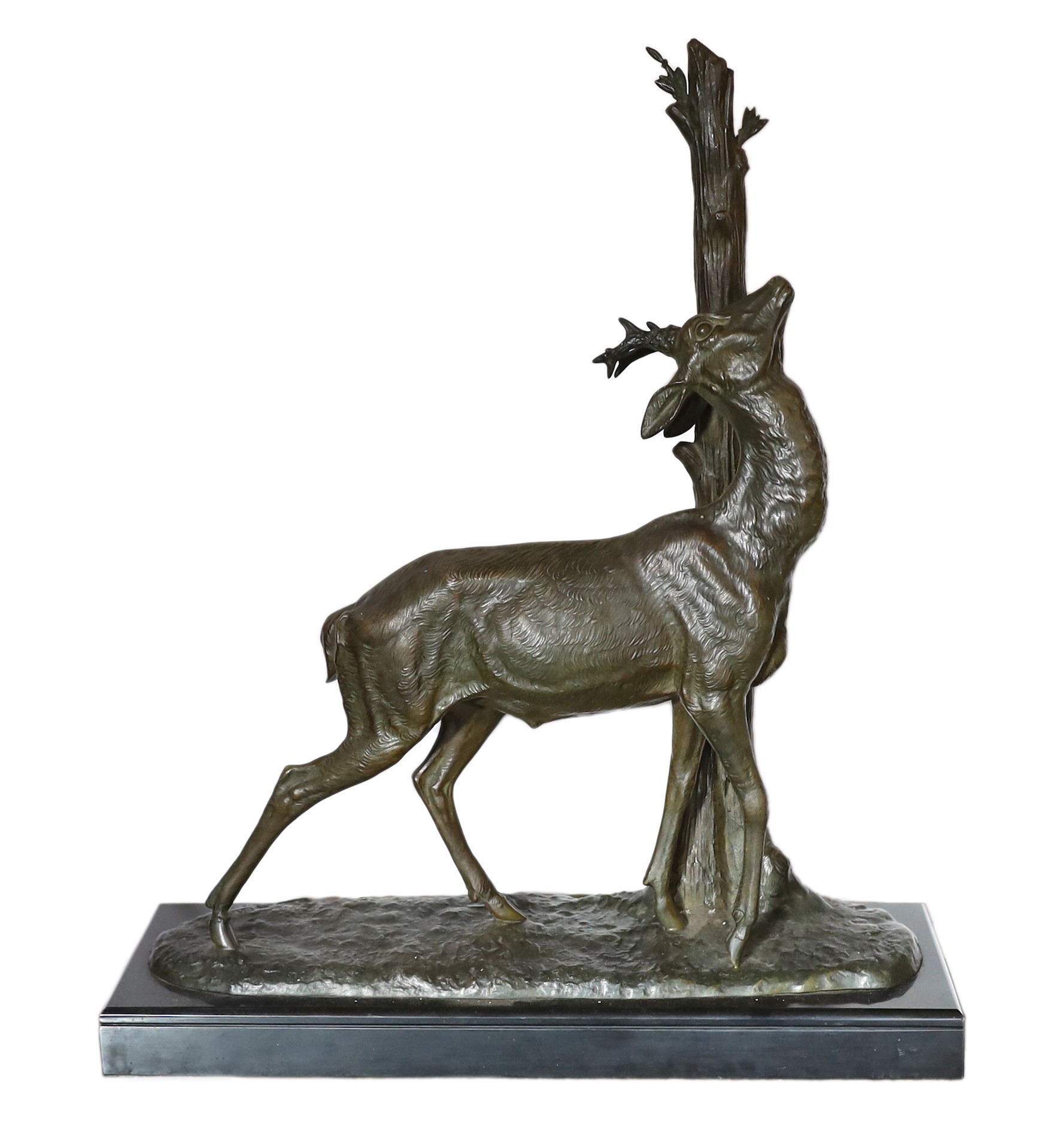 A 1930s French bronzed spelter and marble model of a deer standing beside a tree trunk, signed Cham, height 60cm. width 49cm